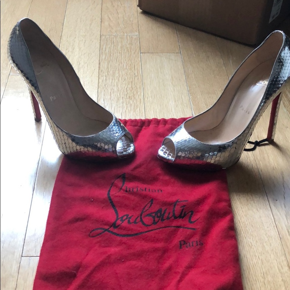 Christian Louboutin silver snakeskin pumps